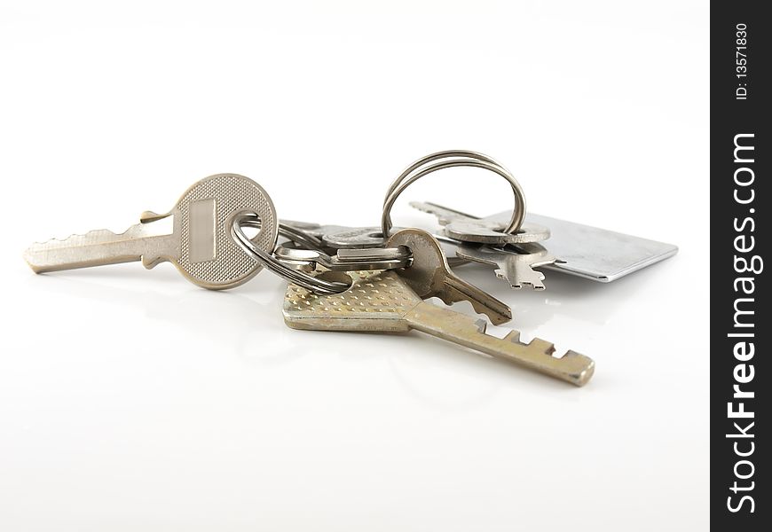 Bunch of old keys on the white background.