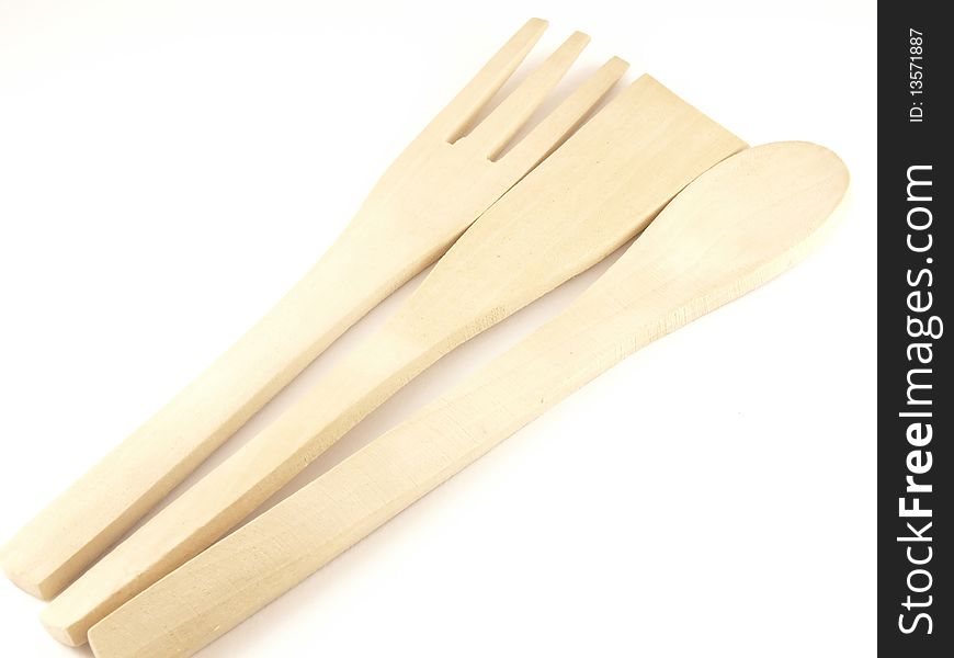 Wooden kitchen-ware on the white background.