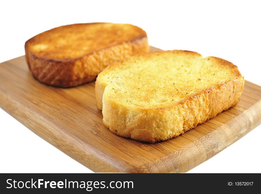 Garlic toasts on a cutting board