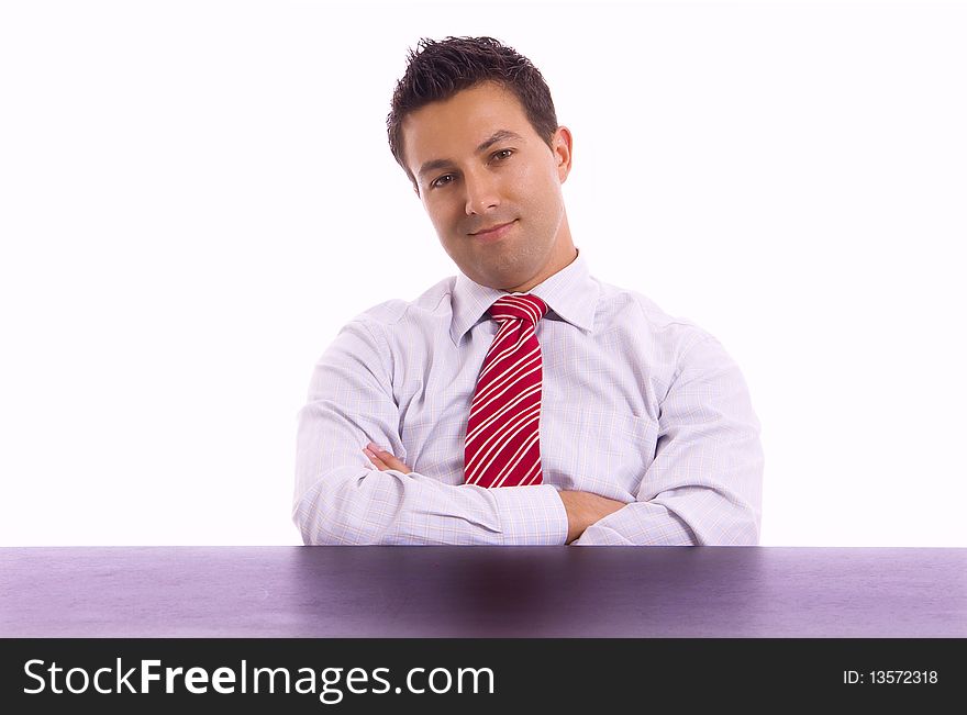 Young business man on a desk, isolated on white background. Young business man on a desk, isolated on white background