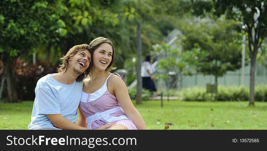 Couple are very happy together in the park. Couple are very happy together in the park