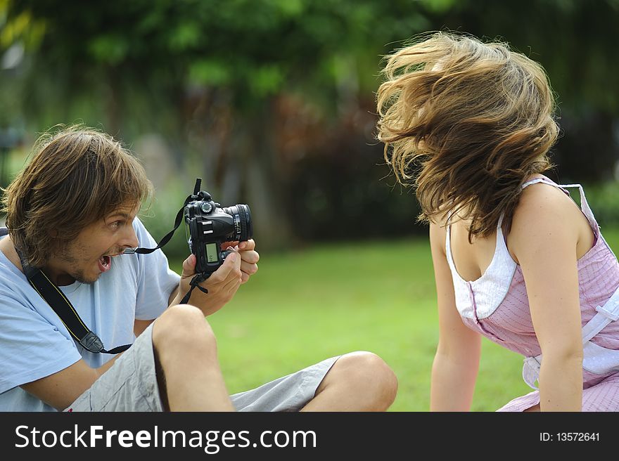 Gorgeous couple take pictures in the park. Gorgeous couple take pictures in the park
