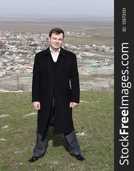 Man Poses On Bishkek Background