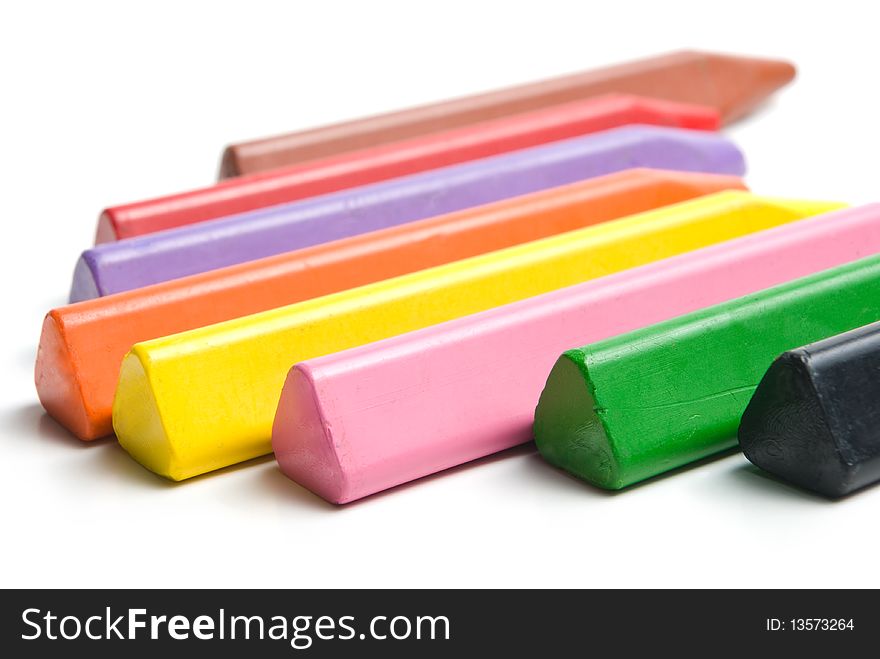 Multicolored crayons. Isolated on white background.
