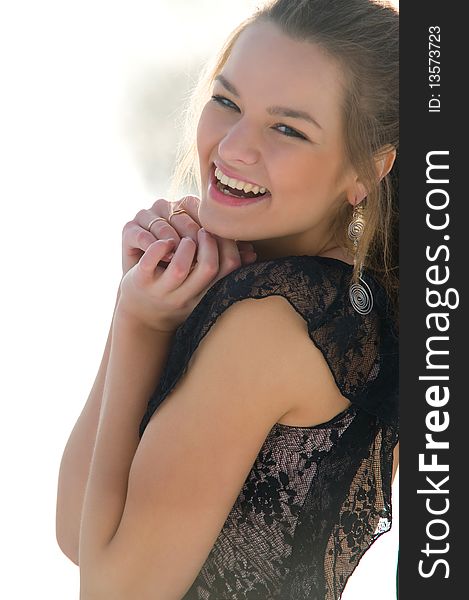 Happy young female smiling while outdoors, close-up portrait