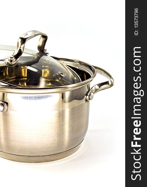 Metallic stew pan against white background