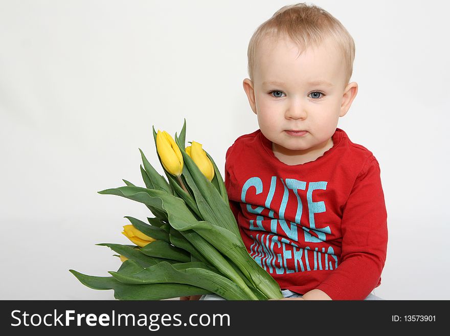 Baby boy with bouquet of flowers. Baby boy with bouquet of flowers