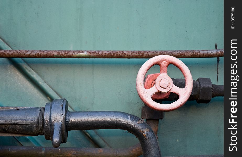 Old Water Valve Against a metal Background