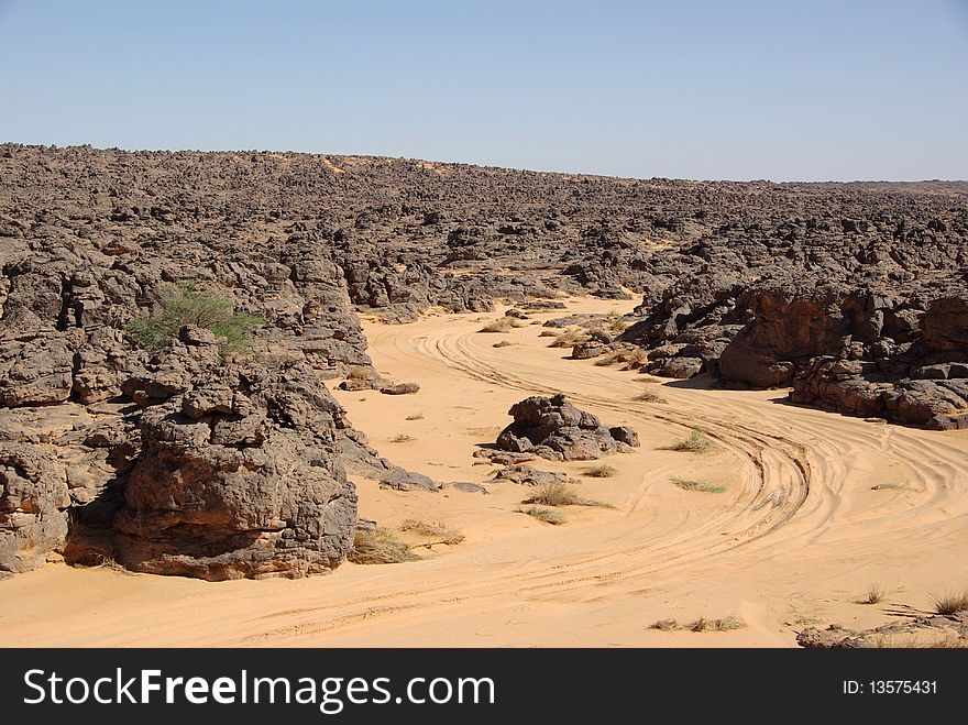 A trail in the desert of Libya, in Africa. A trail in the desert of Libya, in Africa