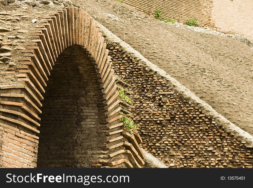Ancient brick arch inside the Roman Colosseum. Ancient brick arch inside the Roman Colosseum