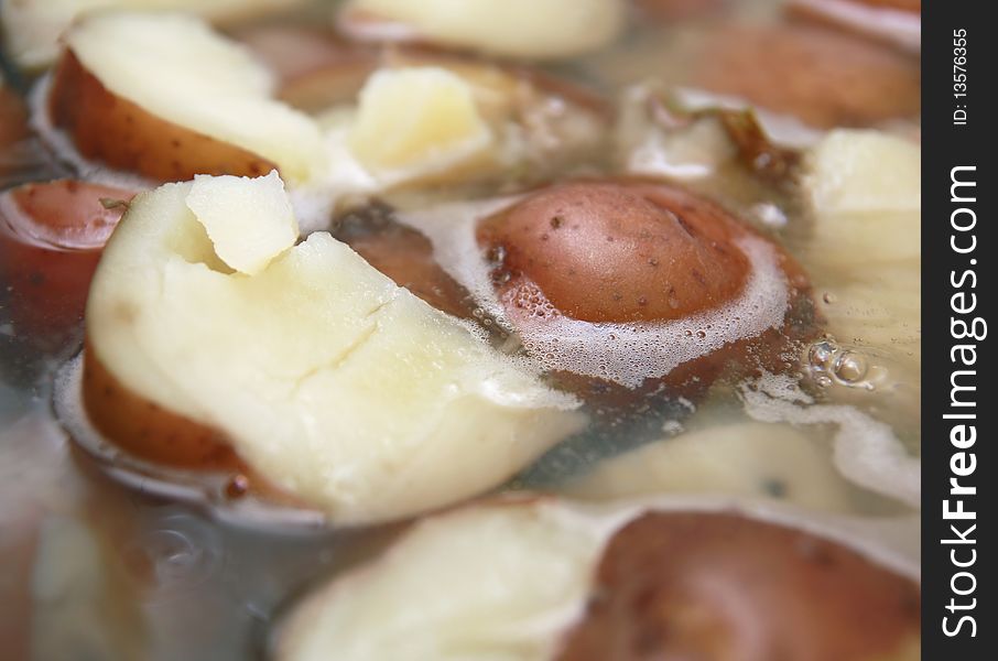 Scrumptious red potatoes simmering in boiling water