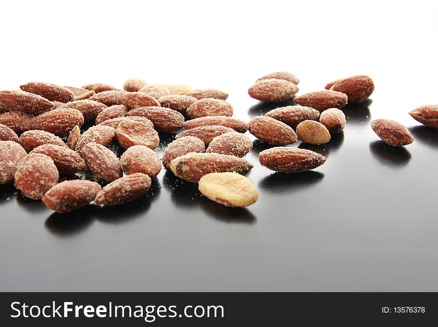 Salty almonds scattered across a table