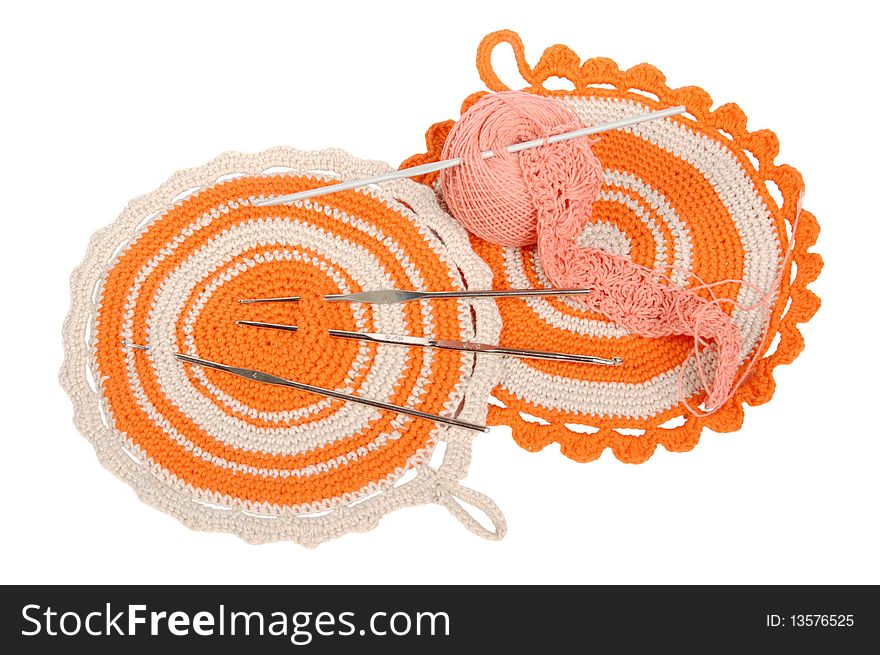 Knitted orange napkins and hooks. Knitted orange napkins and hooks