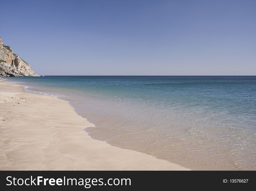 Beautiful view of an idyllic empty beach in summertime. Beautiful view of an idyllic empty beach in summertime