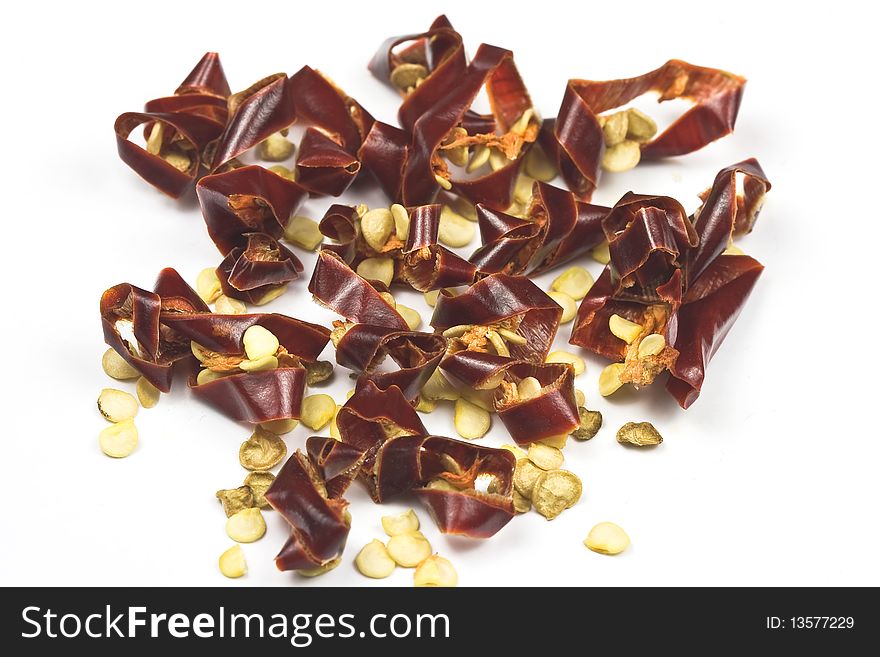 Sun-dried chili pepper isolated on white, macro lens used. Sun-dried chili pepper isolated on white, macro lens used.