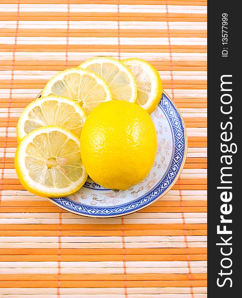 Fragrant tasty useful lemon cup with blue figure on napkin strip
