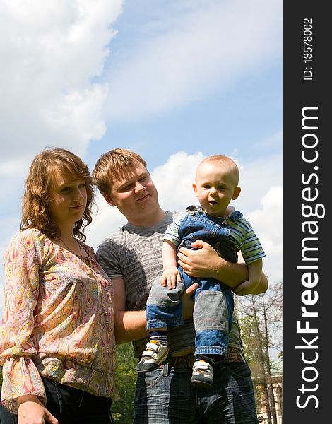 Happy family with son walking outdoors