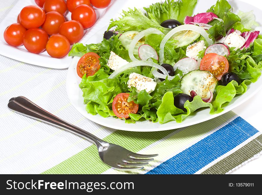 Fresh salad with vegetables and feta cheese. Fresh salad with vegetables and feta cheese