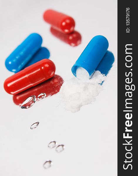 Red and blue tablets.Closeup background
