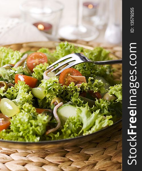 Healthy green salad Isolated on white.