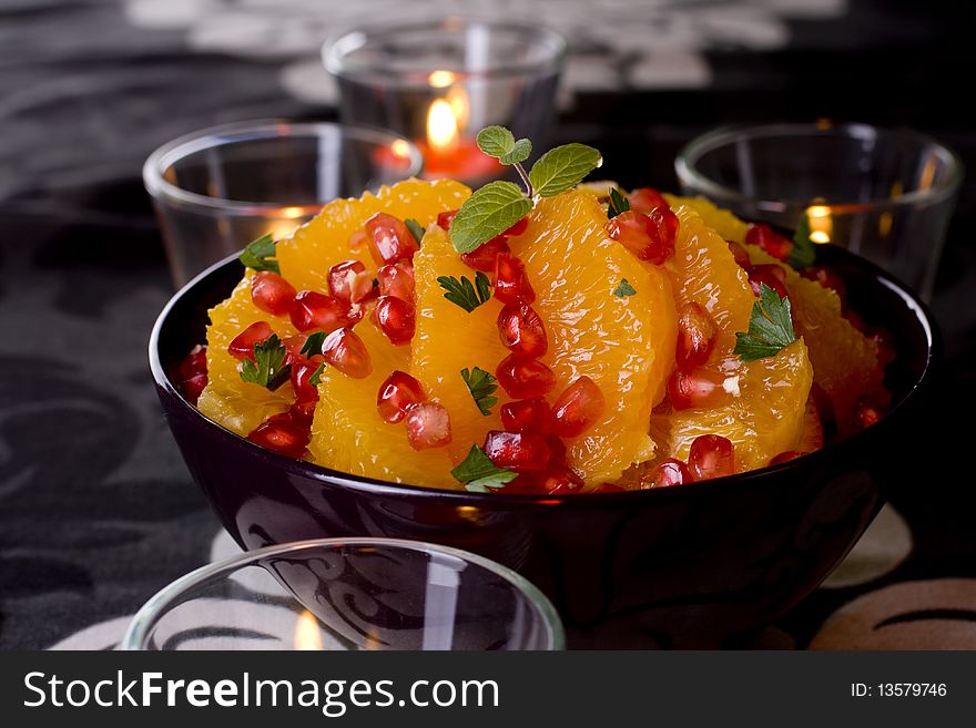 Healthy orange salad Isolated on black background.