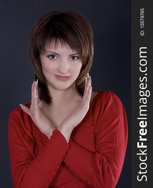 Stunning woman in red dress on black background