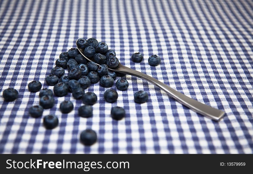 Fresh blueberries on a tabletop. Studio shot.