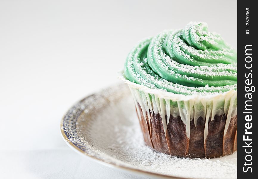 Close-up of a chocolate cupcake with cream cheese topping. Close-up of a chocolate cupcake with cream cheese topping.