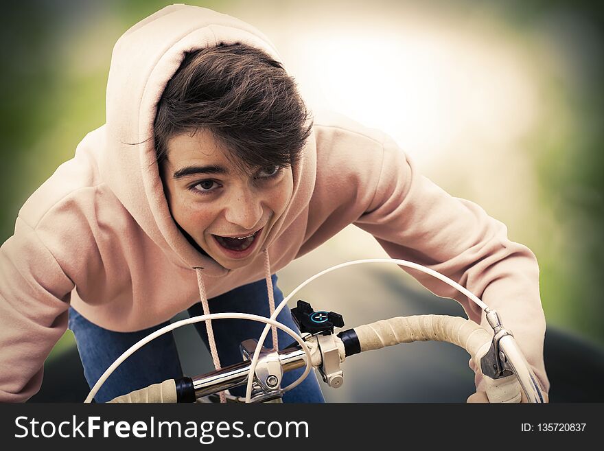Young man on bicycle doing sport