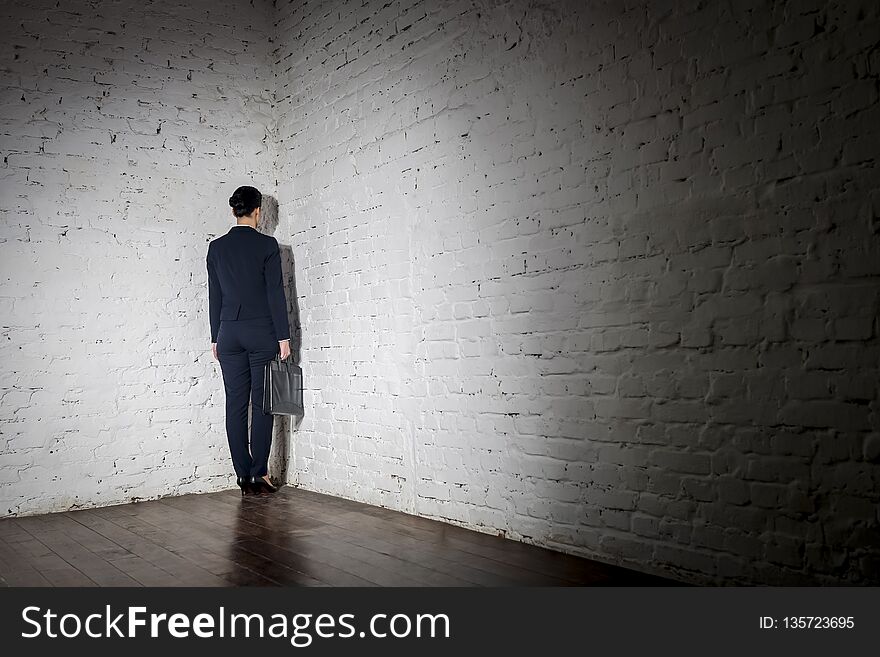 Full Length Rear View Of Businesswoman Standing In Corner At Office