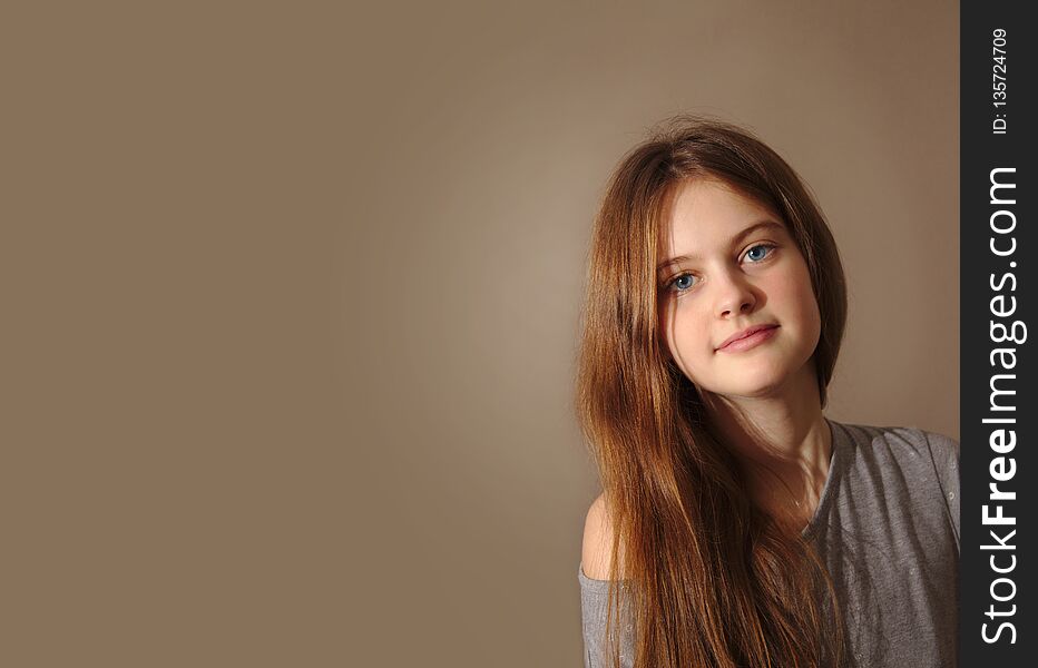 Blue Eyed Brown Haired Shy Girl With Flowing Hair