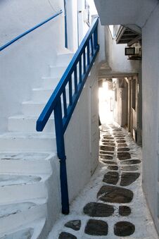 Traditional Narrow Street In Mykonos With Blue Doors And White Walls Royalty Free Stock Photos
