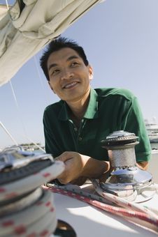 Man On Sailboat Royalty Free Stock Photography Man On Sailboat Royalty Free Stock Photography
