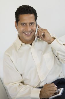 Businessman With PDA And Cell Phone Stock Images