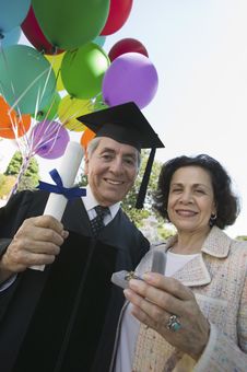 1  Senior graduate receiving present wife Free Stock Photos ...