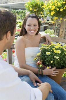 Young Couple Sitting On Bench In Garden Royalty Free Stock Photos Young Couple Sitting On Bench In Garden Royalty Free Stock Photos