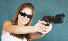Girl In Sunglasses Aiming A Gun Stock Image Girl In Sunglasses Aiming A Gun Stock Image