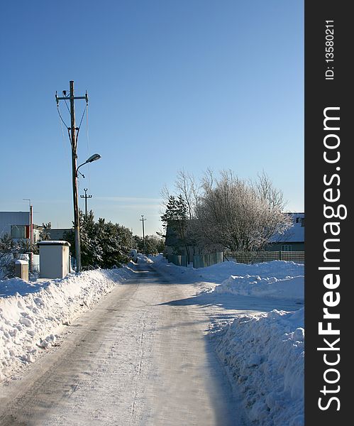 Beautiful empty winter road in a cold sunny day, near city of Tallinn in Estonia. Beautiful empty winter road in a cold sunny day, near city of Tallinn in Estonia