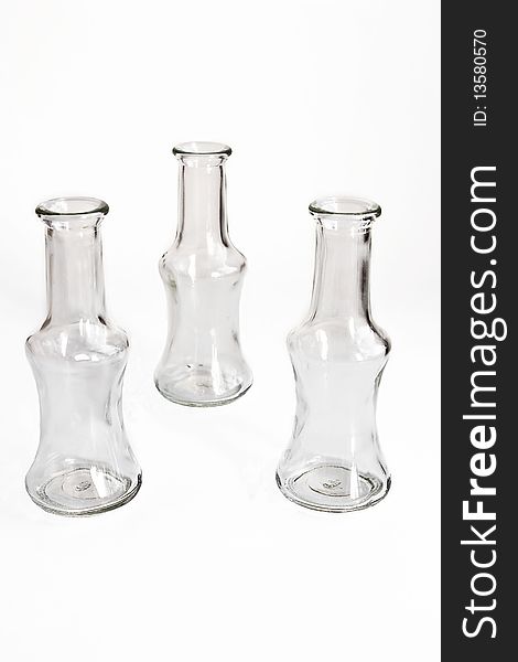 Three small bottles on white background