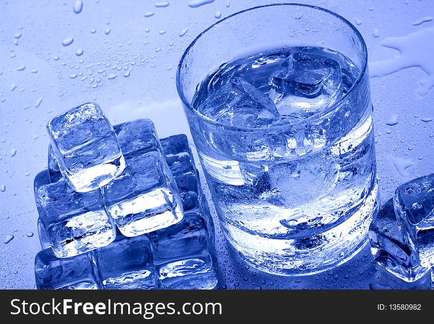 Cold water and ice cubes