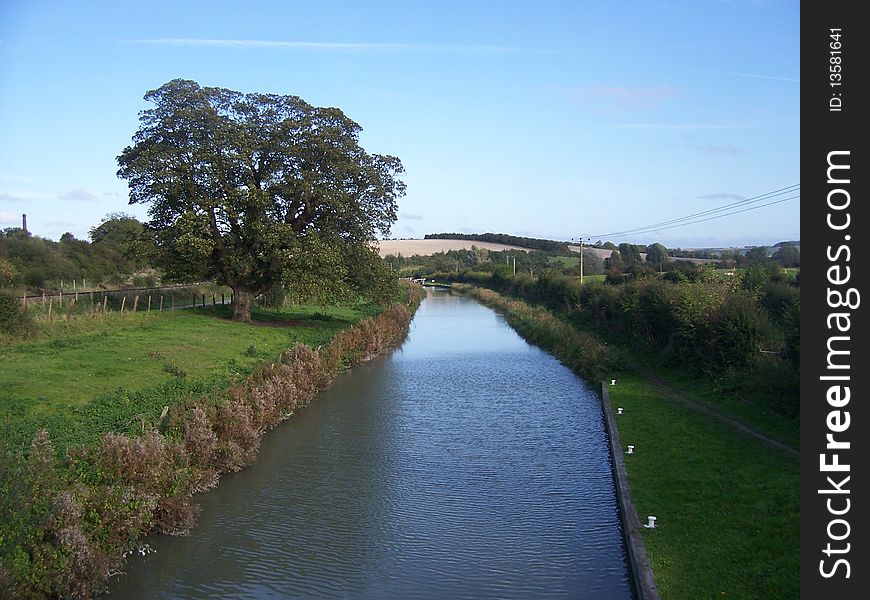 A canal going through the english countryside