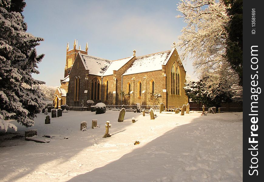 A english church, covered in snow. A english church, covered in snow