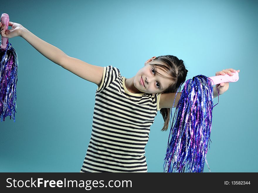 Little girl learning to dance, turquoise background. Little girl learning to dance, turquoise background