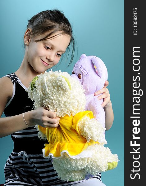 White child playing with teddy bear