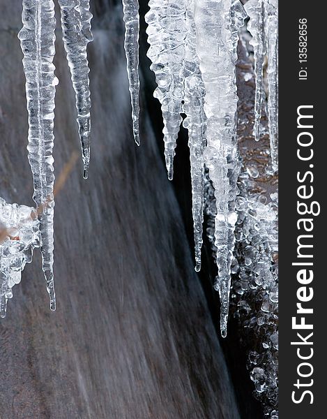 Icicles isolated on a grey background