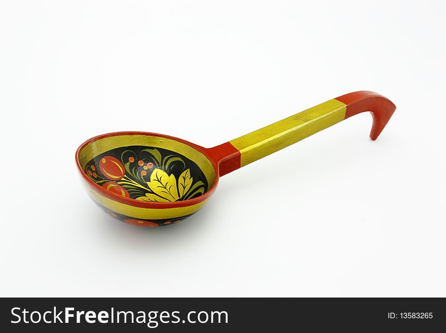 The wooden souvenir ladle decorated with figures