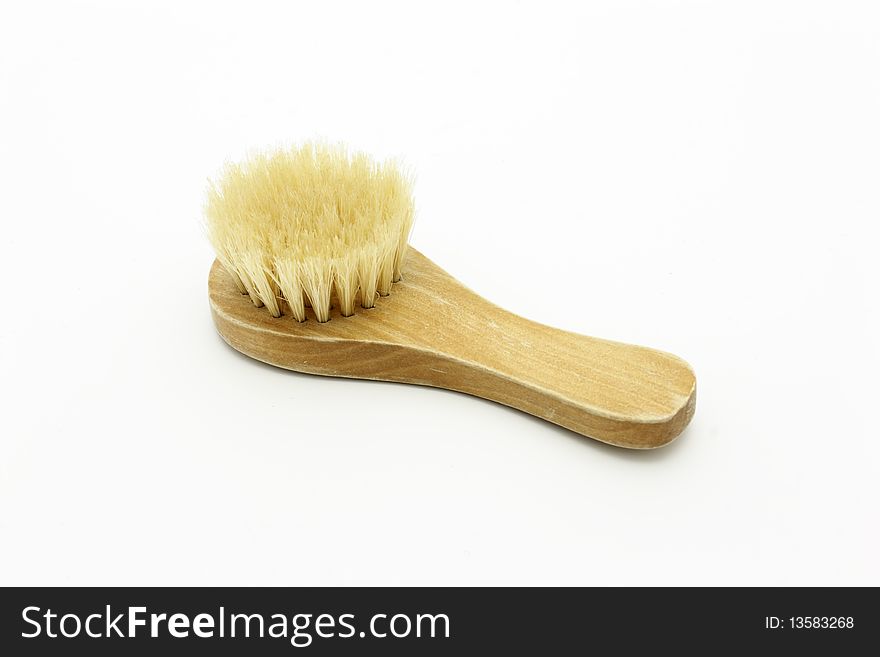 Brush hair with the wooden handle for a sauna and a bath