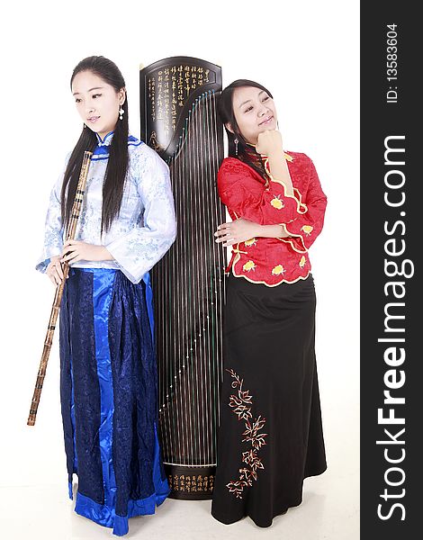 Two Chinese musicians with bamboo flute and zither on white.

Chinese characters on the flute means
wonderful voice,it is taken from one of China's ancient poetry.

Chinese character on zither is Chinese Tang poetry,also a famous Tang Dynasty poet's calligraphy. It praised the unique charm of the zither.