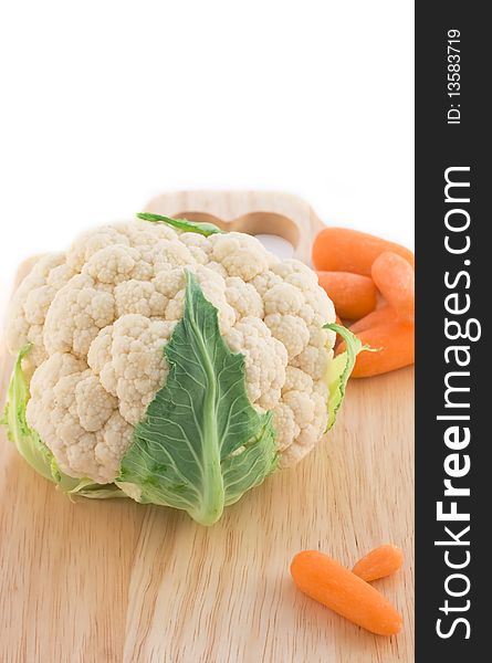 Vegetable (Cauliflower,carrot) on cutting board. Vegetable (Cauliflower,carrot) on cutting board