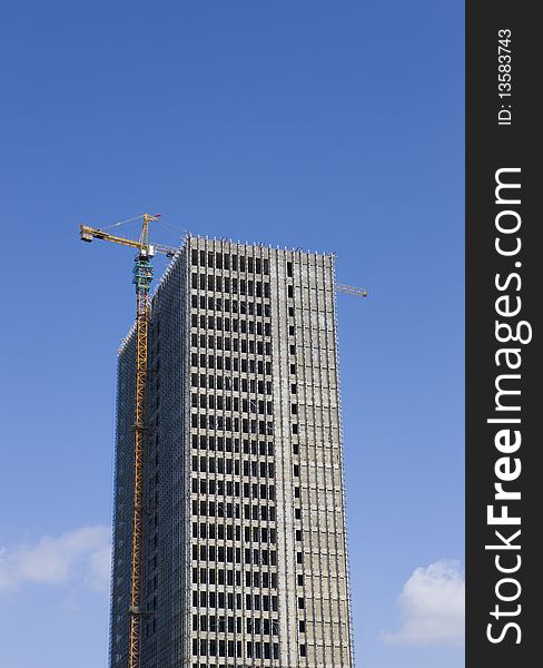 Construction of a high building with blue sky.in China.